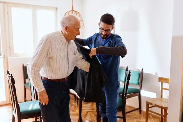 Nurse volunteer visiting senior at home